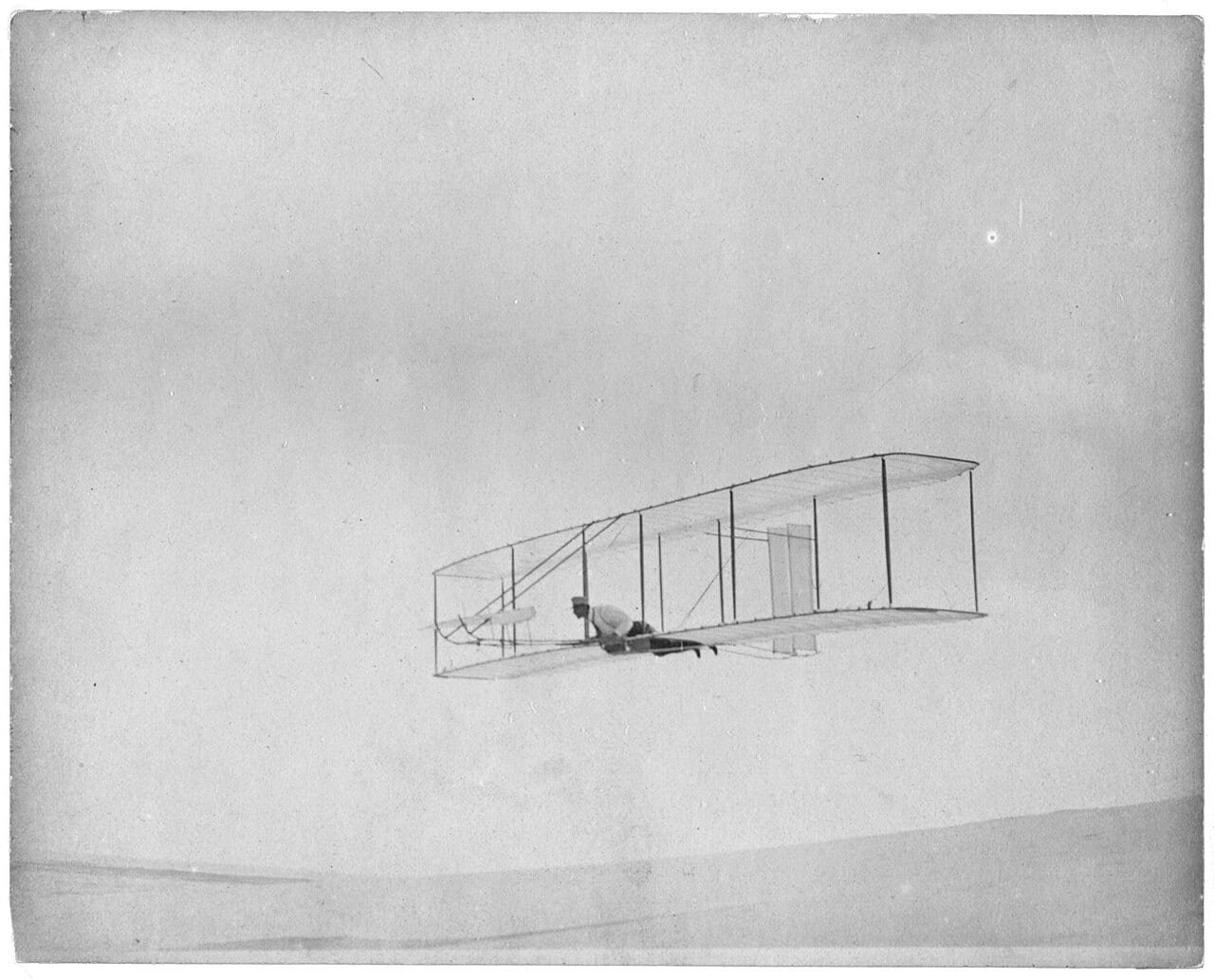 1902 Wright glider gliding above the dunes at Kitty Hawk