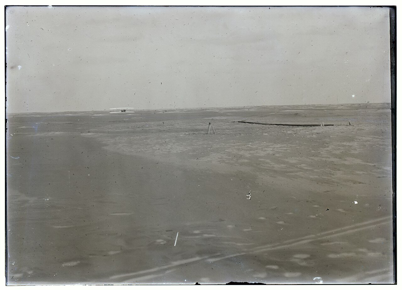 The 1903 Wright Flyer settles on the sand at end of the fourth flight