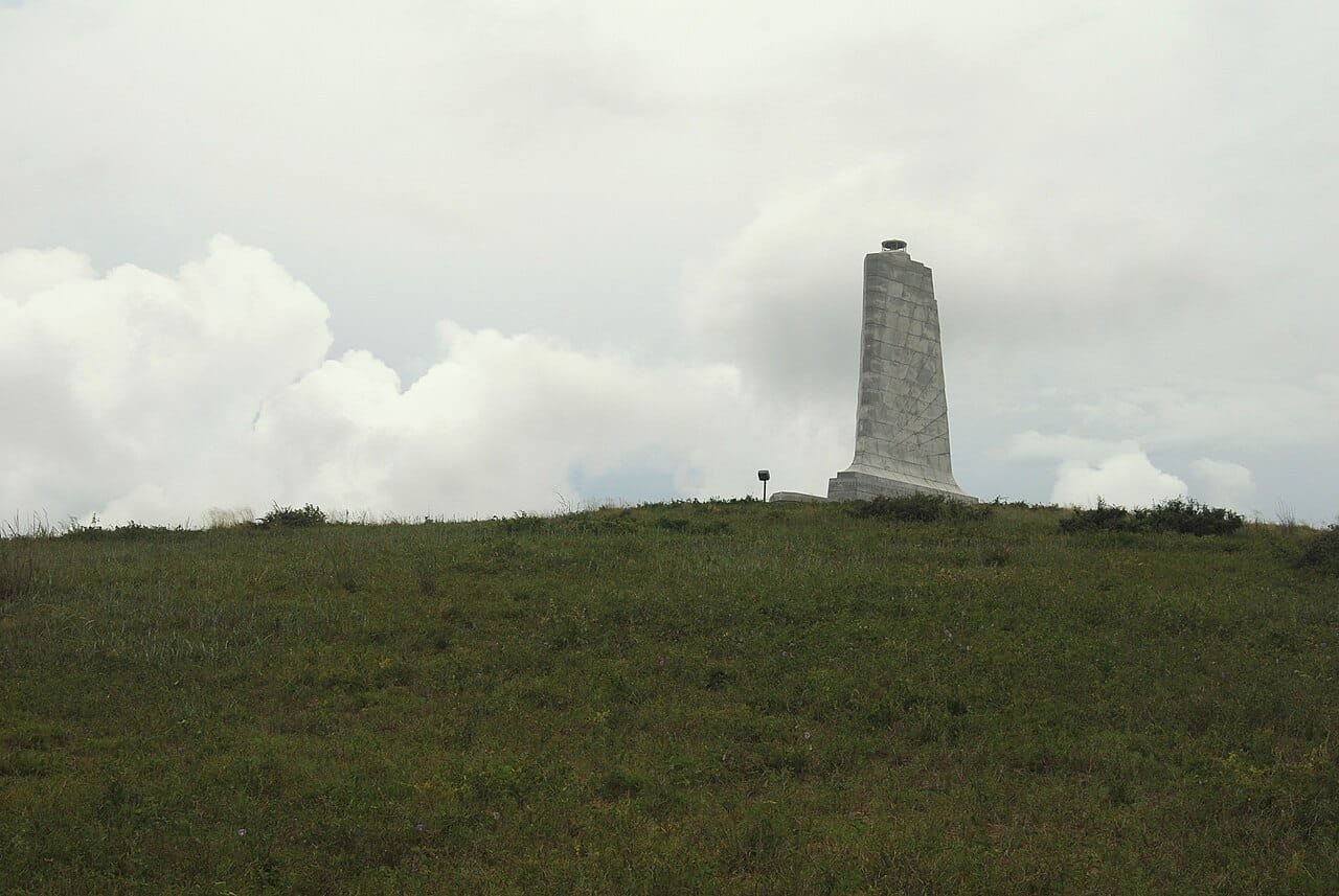 Walking up Kill Devil Hill toward the Wright Brothers Memorial tower