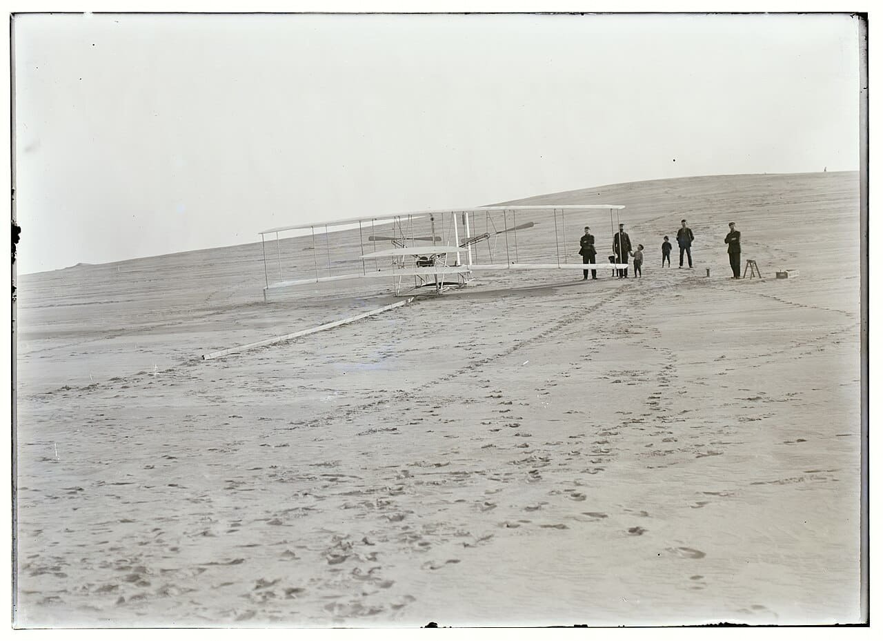 The 1903 Wright Flyer on launching rail at Kill Devil Hills three days before the first successful flight